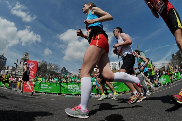 Apr 21, 2013; London, United Kingdom; Fun runners compete during the Virgin London Marathon at the 22 mile mark. Mandatory Credit: Leo Mason-USA TODAY Sports