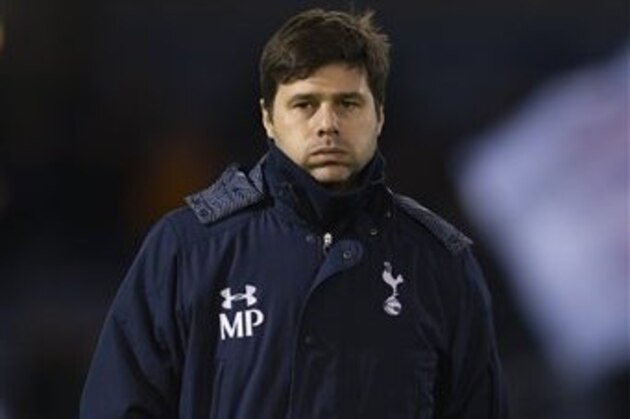 Tottenham's manager Mauricio Pochettino takes to the touchline before his team's English FA Cup third round soccer match against Burnley at Turf Moor Stadium, Burnley, England, Monday, Jan. 5, 2015. (AP Photo/Jon Super)