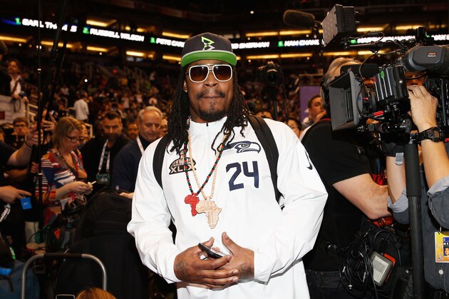 PHOENIX, AZ - JANUARY 27:  Marshawn Lynch #24 of the Seattle Seahawks walks into Super Bowl XLIX Media Day Fueled by Gatorade inside U.S. Airways Center on January 27, 2015 in Phoenix, Arizona.  (Photo by Christian Petersen/Getty Images)