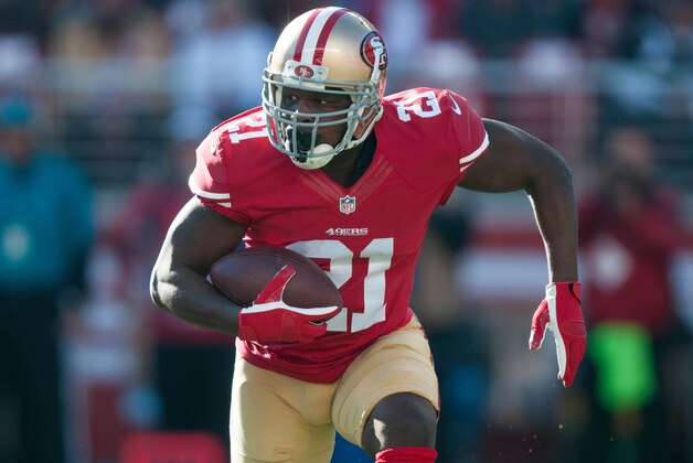 Dec 28, 2014; Santa Clara, CA, USA; San Francisco 49ers running back Frank Gore (21) runs with the ball during the first quarter of the game against the Arizona Cardinals at Levi's Stadium. Mandatory Credit: Ed Szczepanski-USA TODAY Sports