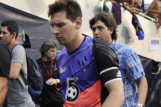 Messi's Friends' Lionel Messi walks off the field after coming out of the game against the Rest of the World during the second half of the Messi and Friends charity soccer exhibition, Saturday, July 6, 2013 in Chicago. Messi's Friends won 9-6.  (AP Photo/Brian Kersey)