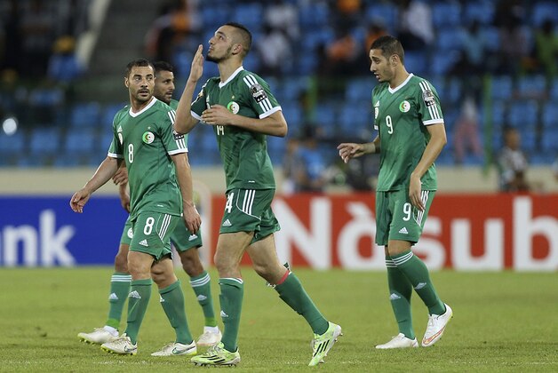 Algeria's,  Nabil Bentaleb, centre, celebrates after he  scored a goal against Senegal  during  their final Group C African Cup of Nations soccer match  at Estadio De Malabo in Malabo, Equatorial Guinea, Tuesday, Jan. 27, 2015. (AP Photo/Sunday Alamba)