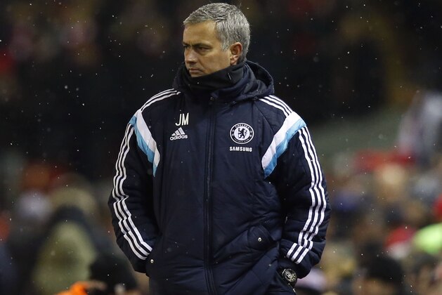 Chelsea's head coach Jose Mourinho watches his team from the sidelines during the English League Cup semi-final first leg soccer match between Liverpool and Chelsea at Anfield Stadium, Liverpool, England, Tuesday Jan. 20, 2015. (AP Photo/Jon Super)