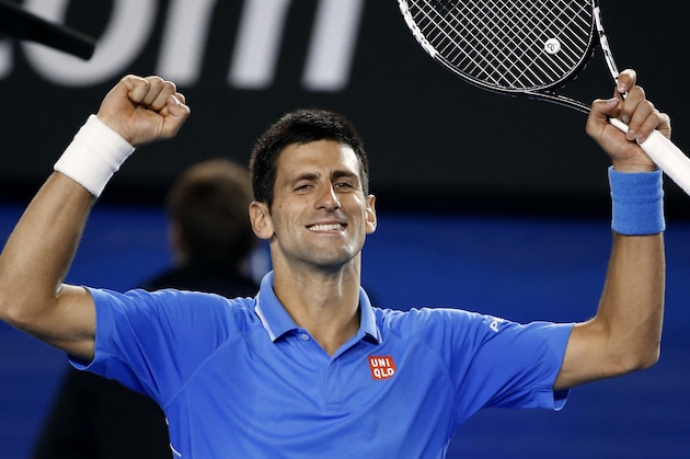 Novak Djokovic of Serbia celebrates after defeating Milos Raonic of Canada in their quarterfinal match at the Australian Open tennis championship in Melbourne, Australia, Wednesday, Jan. 28, 2015. (AP Photo/Vincent Thian)