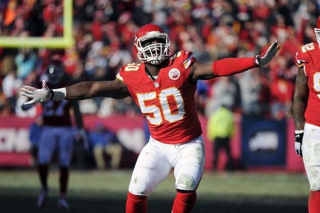 Kansas City Chiefs outside linebacker Justin Houston (50) celebrates a sacking of San Diego Chargers quarterback Philip Rivers with Chiefs nose tackle Dontari Poe (92) looking on during the first half of an NFL football game in Kansas City, Mo., Sunday, Dec. 28, 2014. (AP Photo/Ed Zurga)