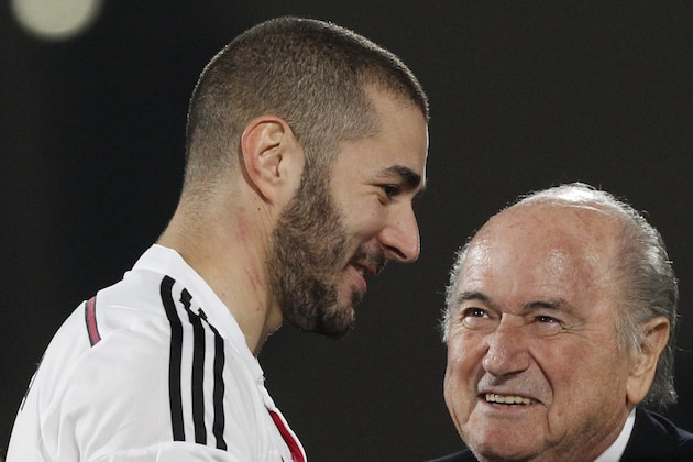 FIFA President Sepp Blatter, right, speaks with Real Madrid’s Karim Benzema after Real Madrid won the final soccer match between Real Madrid and San Lorenzo at the Club World Cup soccer tournament in Marrakech, Morocco, Saturday, Dec. 20, 2014. (AP Photo/Christophe Ena)
