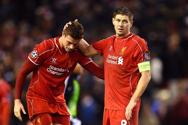 LIVERPOOL, ENGLAND - DECEMBER 09:  (L-R) Dejected Liverpool players Jordan Henderson and Steven Gerrard react following their team's 1-1 draw and exit from the competition during the UEFA Champions League group B match between Liverpool and FC Basel 1893 at Anfield on December 9, 2014 in Liverpool, United Kingdom.  (Photo by Laurence Griffiths/Getty Images)