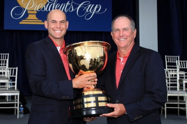 MELBOURNE, AUSTRALIA - NOVEMBER 20:  Bill Haas of the U.S. Team and his father Jay Haas pose with the Presidents Cup trophy at the closing ceremonies after defeating the International team 19-15 at the 2011 Presidents Cup at Royal Melbourne Golf Course on November 20, 2011 in Melbourne, Australia.  (Photo by David Cannon/Getty Images)