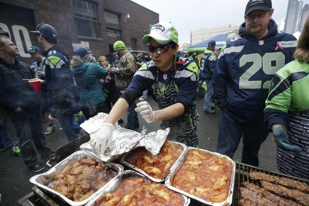 Fans tailgate before the NFL football NFC Championship game between the Green Bay Packers and the Seattle Seahawks Sunday, Jan. 18, 2015, in Seattle. (AP Photo/David J. Phillip) Fans tailgate before the NFL football NFC Championship game between the Green Bay Packers and the Seattle Seahawks Sunday, Jan. 18, 2015, in Seattle. (AP Photo/David J. Phillip)