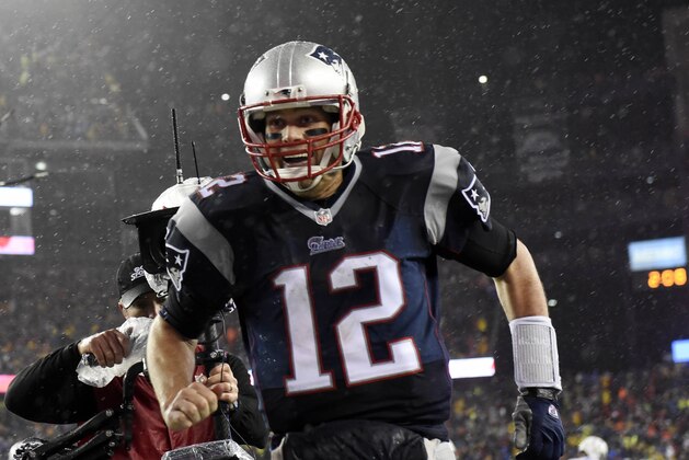 Jan 18, 2015; Foxborough, MA, USA; New England Patriots quarterback Tom Brady (12) celebrates after a touchdown by running back LeGarrette Blount (not pictured) against the Indianapolis Colts in the third quarter in the AFC Championship Game at Gillette Stadium. Mandatory Credit: Robert Deutsch-USA TODAY Sports