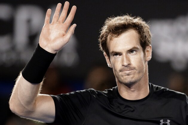 Andy Murray of Britain waves after defeating Nick Kyrgios of Australia in their quarterfinal match at the Australian Open tennis championship in Melbourne, Australia, Tuesday, Jan. 27, 2015. (AP Photo/Lee Jin-man)