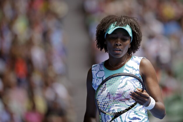 Venus Williams of the U.S.  reacts as she plays her compatriot Madison Keys during their quarterfinal match at the Australian Open tennis championship in Melbourne, Australia, Wednesday, Jan. 28, 2015. (AP Photo/Bernat Armangue)