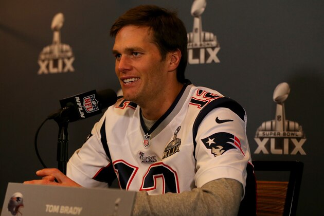 CHANDLER, AZ - JANUARY 28:  Quarterback  Tom Brady #12 of the New England Patriots speaks with the media on January 28, 2015 in Chandler, Arizona.  (Photo by Elsa/Getty Images)