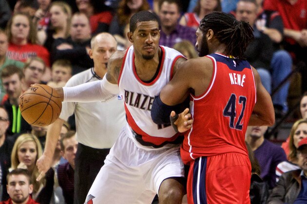 Jan 24, 2015; Portland, OR, USA; Portland Trail Blazers forward LaMarcus Aldridge (12) posts up against Washington Wizards forward Nene Hilario (42) during the fourth quarter at the Moda Center. Mandatory Credit: Craig Mitchelldyer-USA TODAY Sports