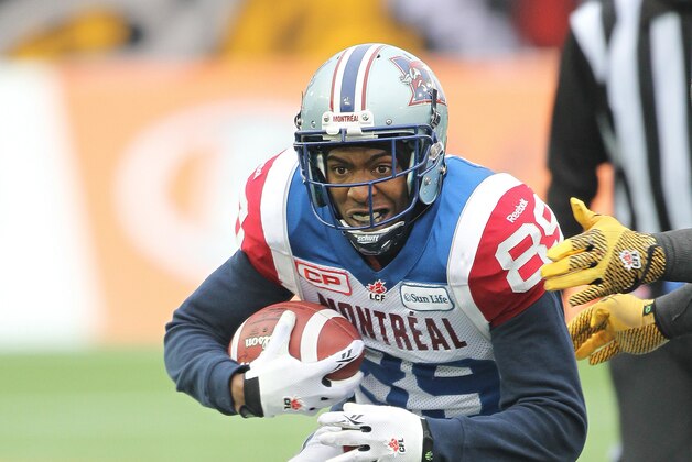 HAMILTON, ON - NOVEMBER 23:  Duron Carter #89 of the Montreal Alouettes runs with the ball against the Hamilton Tiger-Cats in the CFL football Eastern Conference Final at Tim Hortons Field on November 23, 2014 in Hamilton, Ontario, Canada. (Photo by Claus Andersen/Getty Images)