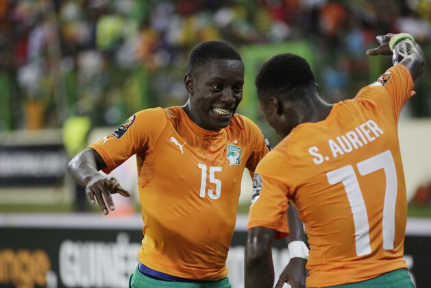 Ivory Coast player Max Alain Gradel, left, dances with teammate Serge Aurier, after he scored a goal against Cameroon during their African Cup of Nations Group D soccer match at Estadio De Malabo in Malabo, Equatorial Guinea, Wednesday, Jan. 28, 2015. (AP Photo/Sunday Alamba)