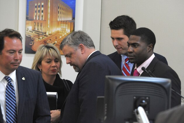 The defense gatherers after the jury was read the charges against Brandon Vandenburg and Cory Batey on Tuesday, Jan. 27, 2015 in Nashville, Tenn.  Vandenburg and Batey, two former Vanderbilt football players,  are each charged with five counts of aggravated rape and two counts of aggravated sexual battery. (AP Photo/The Tennessean, John Partipilo, Pool)
