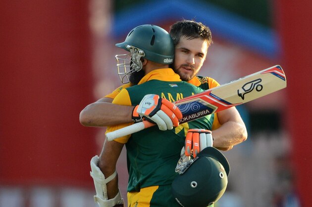 PRETORIA, SOUTH AFRICA - JANUARY 28: Rilee Rossouw of the Proteas celebrates his 100 with Hashim Amla of the Proteas during the 5th Momentum ODI between South Africa and West Indies at SuperSport Park on January 28, 2015 in Pretoria, South Africa. (Photo by Lee Warren/Gallo Images/Getty Images)