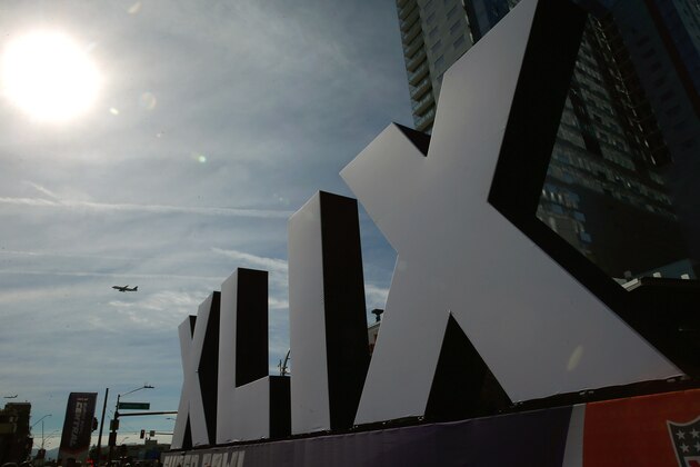 PHOENIX, AZ - JANUARY 28: A plane flys by the Super Bowl XLIX logo in a fan zone for the upcoming game between the Seattle Seahawks and New England Patriots on January 28, 2015 in Phoenix, Arizona. (Photo by Justin Heiman/Getty Images) PHOENIX, AZ - JANUARY 28: A plane flys by the Super Bowl XLIX logo in a fan zone for the upcoming game between the Seattle Seahawks and New England Patriots on January 28, 2015 in Phoenix, Arizona. (Photo by Justin Heiman/Getty Images)