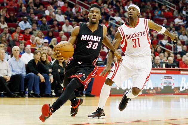 HOUSTON, TX - JANUARY 03:  Norris Cole #30 of the Miami Heat drives with the basketball past Jason Terry #31 of the Houston Rockets during their game at the Toyota Center on January 3, 2015 in Houston, Texas.  NOTE TO USER: User expressly acknowledges and agrees that, by downloading and/or using this photograph, user is consenting to the terms and conditions of the Getty Images License Agreement.  (Photo by Scott Halleran/Getty Images)