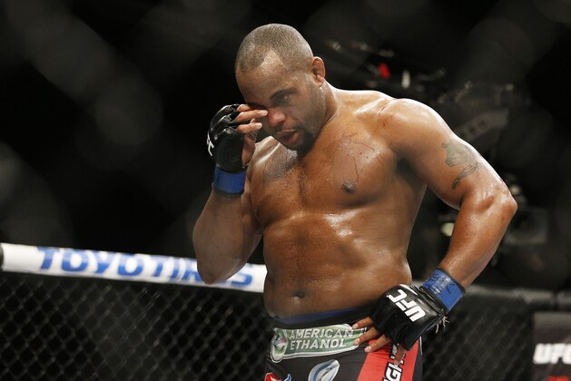 Daniel Cormier rubs his eye after he was poked in the eye by Jon Jones during their light heavyweight title mixed martial arts bout at UFC 182, Saturday, Jan. 3, 2015, in Las Vegas. (AP Photo/John Locher)