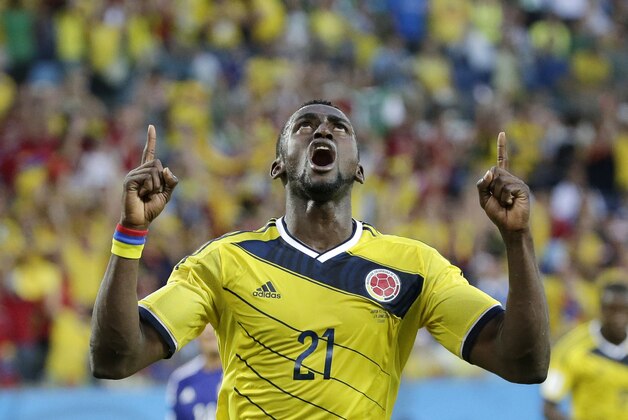 Colombia's Jackson Martinez celebrates after scoring his side's second goal during the group C World Cup soccer match between Japan and Colombia at the Arena Pantanal in Cuiaba, Brazil, Tuesday, June 24, 2014. (AP Photo/Felipe Dana)