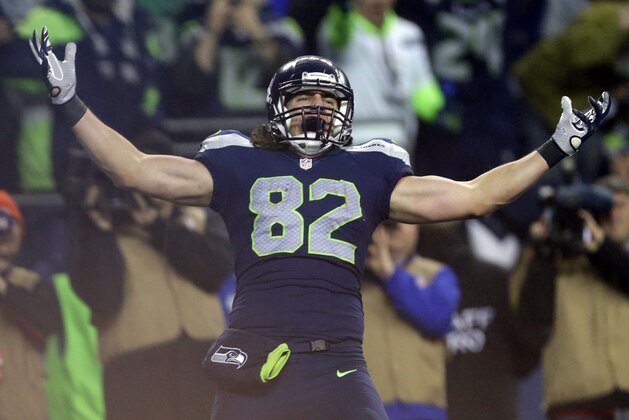 Seattle Seahawks tight end Luke Willson (82) celebrates after catching a 25-yard touchdown pass against the Carolina Panthers during the second half of an NFL divisional playoff football game in Seattle, Saturday, Jan. 10, 2015.(AP Photo/John Froschauer)