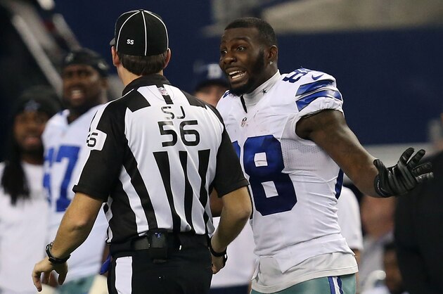 ARLINGTON, TX - JANUARY 04:  Dez Bryant #88 of the Dallas Cowboys argues with side judge Allen Baynes #56 after a penatly was called against Anthony Hitchens #59 of the Dallas Cowboys when he collided with Brandon Pettigrew #87 of the Detroit Lions on a pass play during the second half of their NFC Wild Card Playoff game at AT&T Stadium on January 4, 2015 in Arlington, Texas.  (Photo by Sarah Glenn/Getty Images)