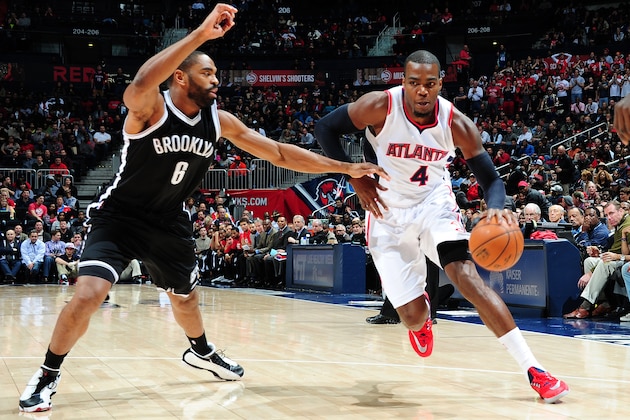 ATLANTA, GA - JANUARY 28: Paul Millsap #4 of the Atlanta Hawks drives against the Brooklyn Nets on January 28, 2015 at Philips Arena in Atlanta, Georgia.  NOTE TO USER: User expressly acknowledges and agrees that, by downloading and/or using this Photograph, user is consenting to the terms and conditions of the Getty Images License Agreement. Mandatory Copyright Notice: Copyright 2015 NBAE (Photo by Scott Cunningham/NBAE via Getty Images)
