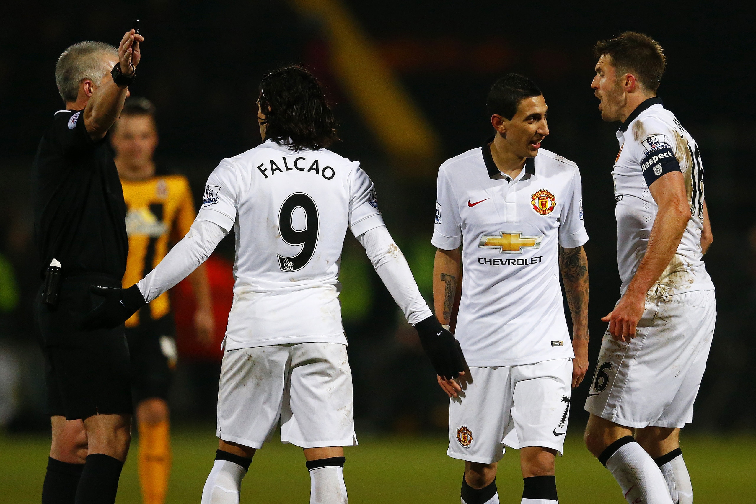 CAMBRIDGE, ENGLAND - JANUARY 23:  Radamel Falcao Garcia, Angel di Maria and Michael Carrick of Manchester United argue with referee Chris Foy during the FA Cup Fourth Round match between Cambridge United and Manchester United at The R Costings Abbey Stadium on January 23, 2015 in Cambridge, England.  (Photo by Julian Finney/Getty Images)