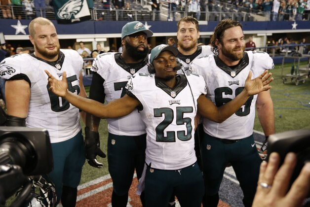 Nov 27, 2014; Arlington, TX, USA; Philadelphia Eagles running back LeSean McCoy (25) poses with the Galloping Gobbler award and tackle Lane Johnson (65) Jason Peters (71) guard Andrew Gardner (66) and Evan Mathis (69) after the game against the Dallas Cowboys at AT&T Stadium. The Eagles beat the Cowboys 33-10. Mandatory Credit: Matthew Emmons-USA TODAY Sports