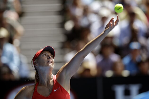 Maria Sharapova of Russia serves to her compatriot Ekaterina Makarova during their semifinal match at the Australian Open tennis championship in Melbourne, Australia, Thursday, Jan. 29, 2015. (AP Photo/Bernat Armangue)