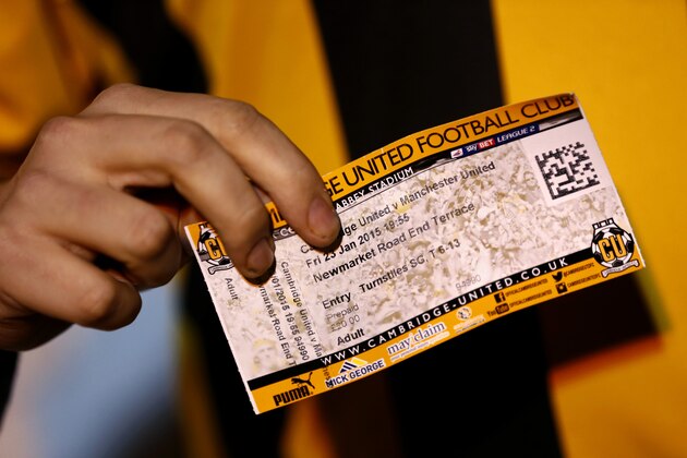 CAMBRIDGE, ENGLAND - JANUARY 23:  A fan poses with a ticket before the FA Cup Fourth Round match between Cambridge United and Manchester United at The R Costings Abbey Stadium on January 23, 2015 in Cambridge, England.  (Photo by Julian Finney/Getty Images)
