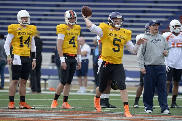 Jan 22, 2015; Mobile, AL, USA; North squad quarterback Bryce Petty of Baylor (14) and quarterback Sean Mannion of Oregon State (4) watch as quarterback Shane Carden of East Carolina (5) throws a pass during Senior Bowl North squad practice at Ladd-Peebles Stadium. Mandatory Credit: Glenn Andrews-USA TODAY Sports