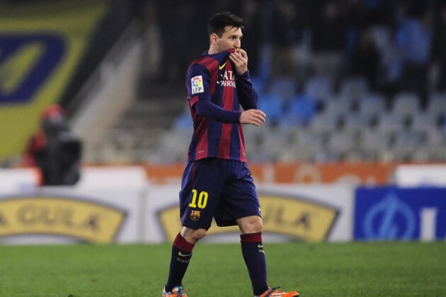 Barcelona's Lionel Messi of Argentina leaves the pitch at the end of the match during their La Liga soccer match against Real Sociedad, at Anoeta stadium in San Sebastian, northern Spain, Sunday, Jan.4, 2015.  Barcelona lose the match 1-0.(AP Photo/Alvaro Barrientos)