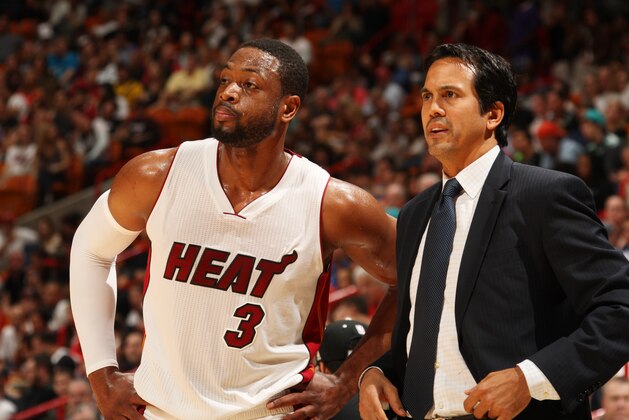 MIAMI, FL - DECEMBER 27:  Dwyane Wade #3 of the Miami Heat looks on with Head Coach Erik Spoelstra during the game against the Memphis Grizzlies on December 27, 2014 at American Airlines Arena in Miami, Florida.  NOTE TO USER: User expressly acknowledges and agrees that, by downloading and or using this Photograph, user is consenting to the terms and conditions of the Getty Images License Agreement. Mandatory Copyright Notice: Copyright 2014 NBAE (Photo by Issac Baldizon/NBAE via Getty Images)