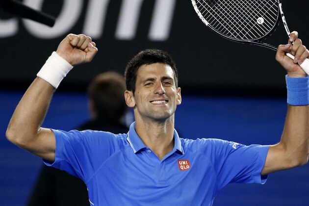 Novak Djokovic of Serbia celebrates after defeating Milos Raonic of Canada in their quarterfinal match at the Australian Open tennis championship in Melbourne, Australia, Wednesday, Jan. 28, 2015. (AP Photo/Vincent Thian)