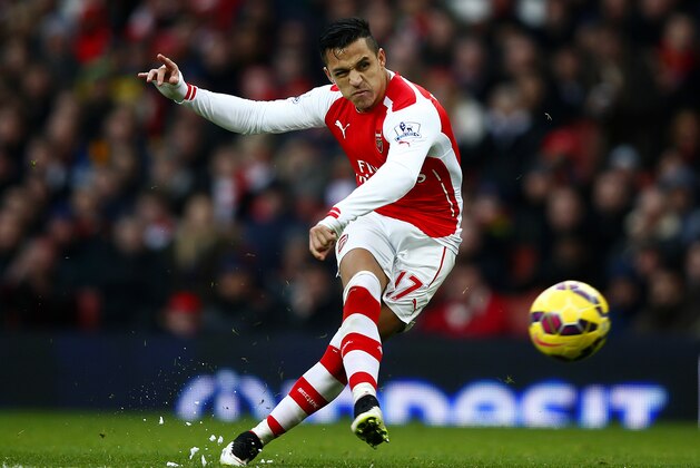 LONDON, ENGLAND - JANUARY 11:  Alexis Sanchez of Arsenal scores his team's third goal during the Barclays Premier League match between Arsenal and Stoke City at Emirates Stadium on January 11, 2015 in London, England.  (Photo by Clive Rose/Getty Images)