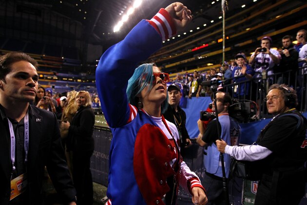 INDIANAPOLIS, IN - FEBRUARY 05:  Singer Katy Perry celebrates on the field after the New York Giants defeated the New England Patriots in Super Bowl XLVI at Lucas Oil Stadium on February 5, 2012 in Indianapolis, Indiana. The New York Giants defeated the New England Patriots 21-17.  (Photo by Al Bello/Getty Images)