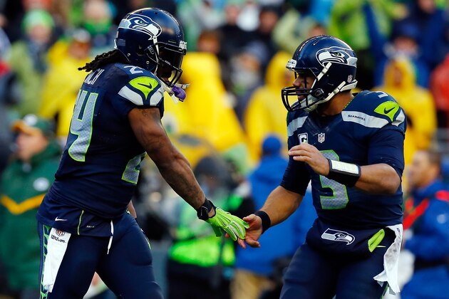 SEATTLE, WA - JANUARY 18: Marshawn Lynch #24 celebrates with Russell Wilson #3 of the Seattle Seahawks during the fourth quarter of the 2015 NFC Championship at CenturyLink Field on January 18, 2015 in Seattle, Washington.  (Photo by Tom Pennington/Getty Images)