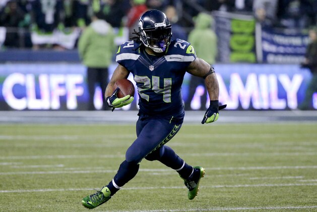 Seattle Seahawks running back Marshawn Lynch runs against the Carolina Panthers during the second half of an NFL divisional playoff football game in Seattle, Saturday, Jan. 10, 2015. (AP Photo/Ted S. Warren)