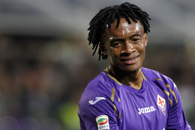 Fiorentina's Juan Cuadrado looks down during a Serie A soccer match between Fiorentina and Sassuolo at the Artemio Franchi stadium in Florence, Italy, Wednesday, Sept. 24, 2014. (AP Photo/Fabrizio Giovannozzi)