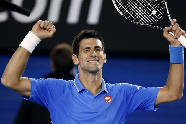 Novak Djokovic of Serbia celebrates after defeating Milos Raonic of Canada in their quarterfinal match at the Australian Open tennis championship in Melbourne, Australia, Wednesday, Jan. 28, 2015. (AP Photo/Vincent Thian)