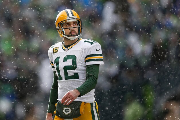 SEATTLE, WA - JANUARY 18:  Quarterback Aaron Rodgers #12 of the Green Bay Packers walks off the field during the 2015 NFC Championship game against the Seattle Seahawks at CenturyLink Field on January 18, 2015 in Seattle, Washington. The Seahawks defeated the Packers 28-22 in overtime.  (Photo by Christian Petersen/Getty Images)