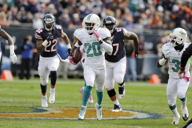Miami Dolphins free safety Reshad Jones (20) carries the ball against Chicago Bears defense during the first half of an NFL football game Sunday, Oct. 19, 2014 in Chicago. (AP Photo/Nam Y. Huh)