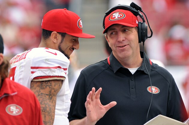 TAMPA, FL -  DECEMBER 15:  Quarterback Colin Kaepernick #7 of the San Francisco 49ers talks with quarterbacks coach Geep Chryst during play against the Tampa Bay Buccaneers December 15, 2013 at Raymond James Stadium in Tampa, Florida. (Photo by Al Messerschmidt/Getty Images)