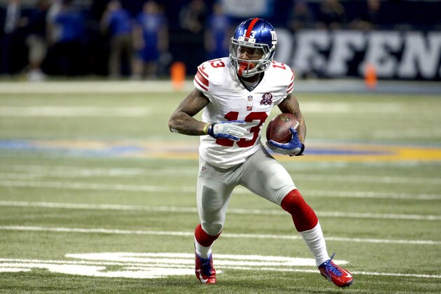 New York Giants wide receiver Odell Beckham Jr. runs with the ball after catching a pass for an 8-yard gain during the first half of an NFL football game against the St. Louis Rams Sunday, Dec. 21, 2014, in St. Louis. (AP Photo/Charlie Riedel)