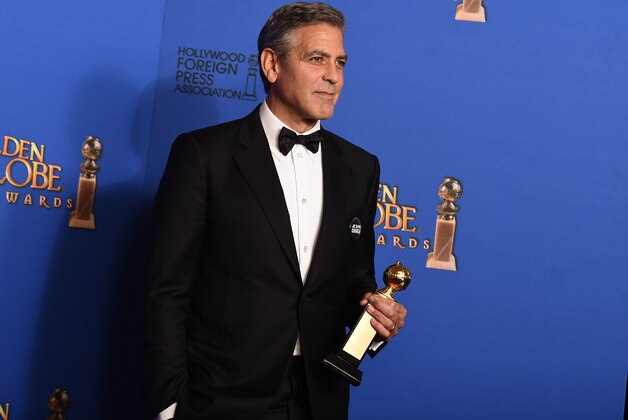 George Clooney poses in the press room with the Cecil B. Demille award at the 72nd annual Golden Globe Awards at the Beverly Hilton Hotel on Sunday, Jan. 11, 2015, in Beverly Hills, Calif. (Photo by Jordan Strauss/Invision/AP)