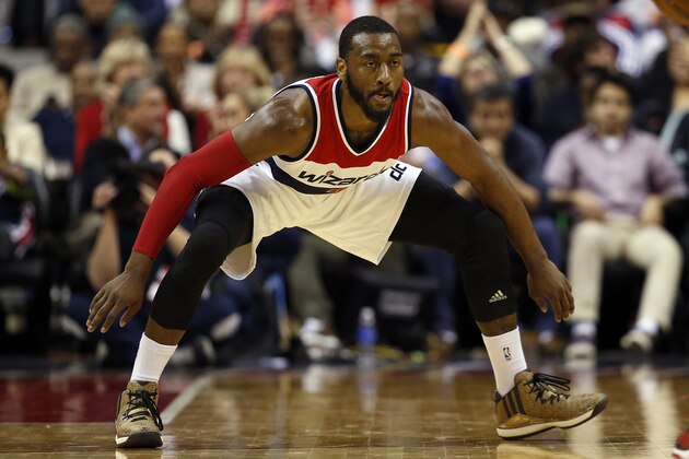 Washington Wizards guard John Wall (2) stands ready in the second half of an NBA basketball game against the Philadelphia 76ers, Monday, Jan. 19, 2015, in Washington. The Wizards won 111-76. (AP Photo/Alex Brandon)
