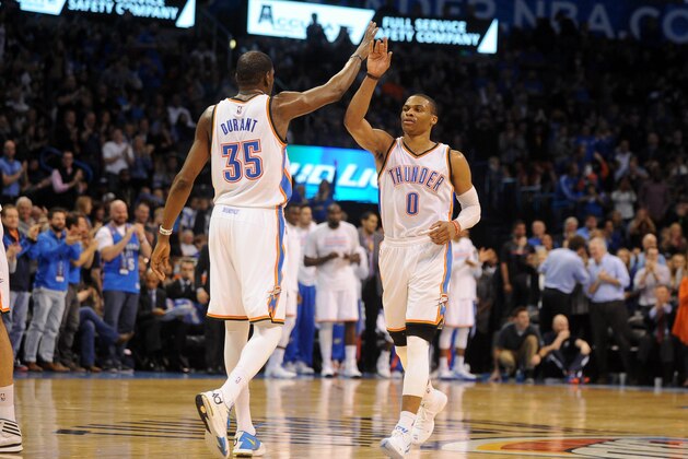 Jan 16, 2015; Oklahoma City, OK, USA;  Oklahoma City Thunder guard Russell Westbrook (0) congratulates Oklahoma City Thunder forward Kevin Durant (35) after a play against the Golden State Warriors during the second quarter at Chesapeake Energy Arena. Mandatory Credit: Mark D. Smith-USA TODAY Sports
